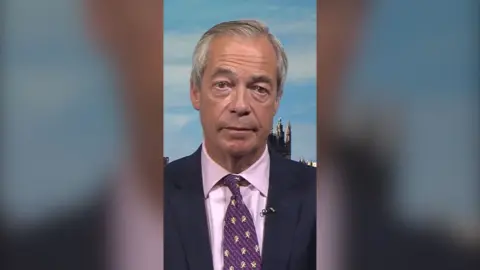 Nigel Farage in a suit and tie 
