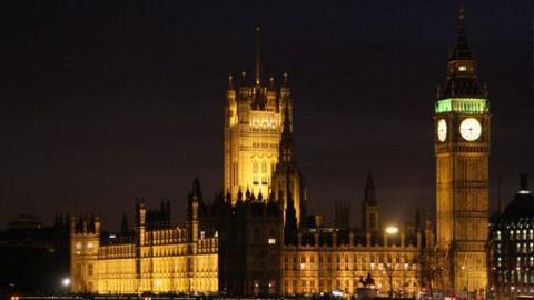 The Houses of Parliament and Big Ben are shown at night.