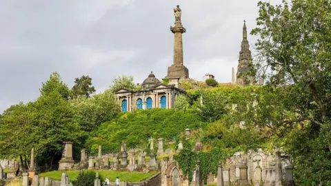 Getty Images The Necropolis graveyard with graves of all shapes and sizes, including some towering sculptures