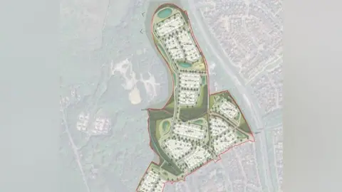 A map of a housing development plan with green spaces surrounding white blocks of housing. The outline of the development from an aerial view is phallic in nature