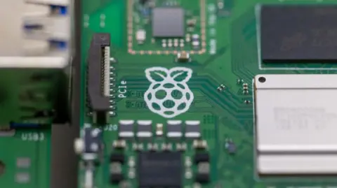 Bloomberg via Getty Images A close up of a Raspberry Pi computer with the white logo of a raspberry
