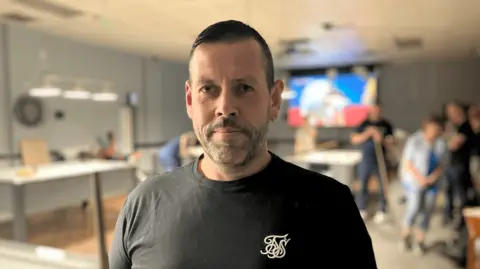 Charlotte Wright Ricky Peirce holding a pool cue at Dover Working Men's Club