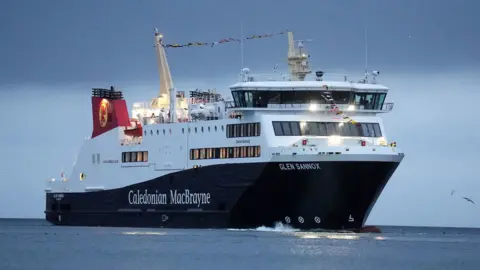 PA Media A large black and white ferry with red funnels and the words Caledonian MacBrayne written on the side