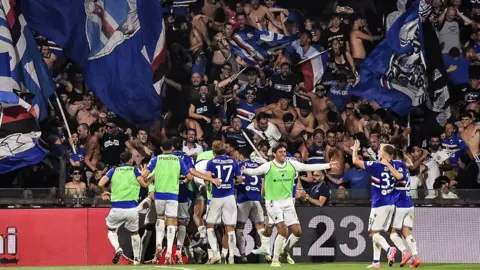Sampdoria players celebrate after Massimo Coda's goal