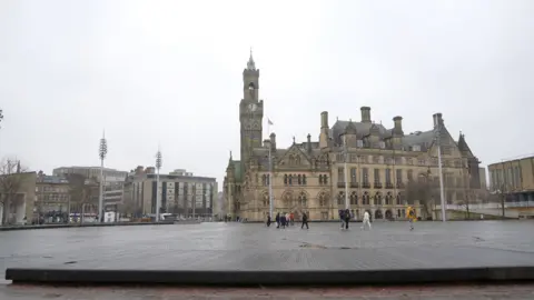 The mirror pool in Bradford, not being used, with City Hall behind it. 