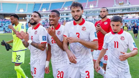 Tunisia players celebrate