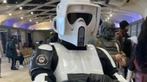 BBC/ Carla Fowler Person in a white Star Wars Stormtrooper costume