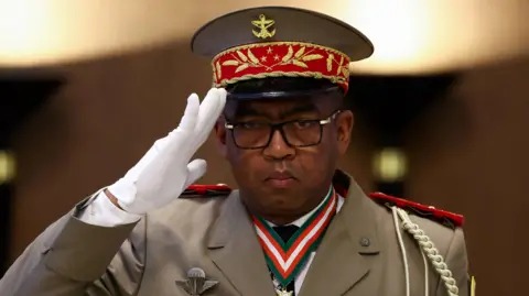 Reuters Military general Ruphin Fortunat Zafisambo gestures after being named Prime Minister by Madagascar's President Andry Rajoelina at the Lavoloha Presidential Palace