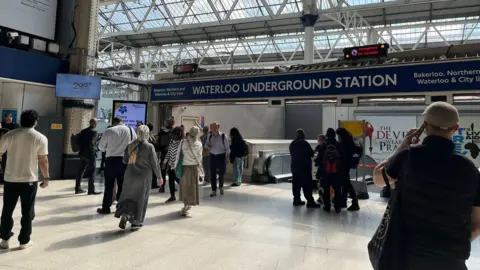 Waterloo station passengers outside closed Underground