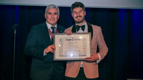 Brendan Rodrigues Photography Mathew Knight receiving Magic Circle award
