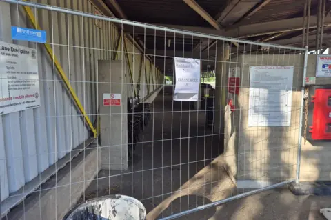 Fencing blocking off the main stand at Harvey Hadden Stadium.