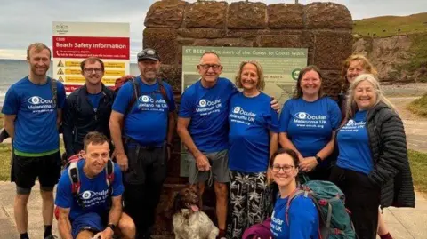 Supplied Family and friends have joined Anne Haslam's two brothers for parts of the walk
Peter is on the left at the front and David is third from the left at the back 