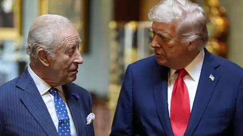 King Charles and US President Donald Trump at Windsor Castle, September 2025 in Windsor Castle. Both are wearing dark suits.
