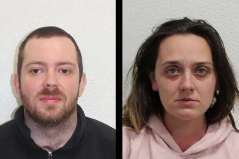 Metropolitan Police Police custody photos of O'Connor and Coutts. He has a beard and wears a black hooded top. She has long dark hair and wears a pink hooded top. 