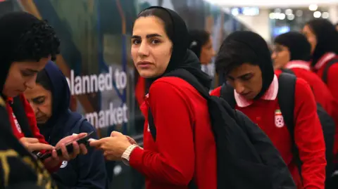 EPA Members of Iranian women's national soccer team arrive at the Kuala Lumpur International Airport in Sepang, Malaysia