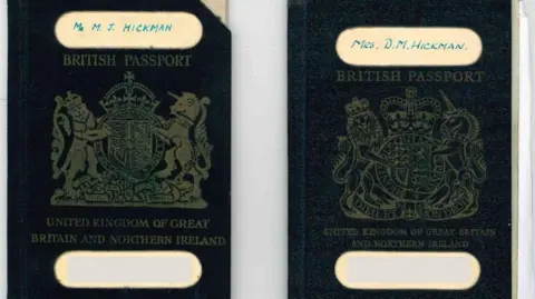 Surrey Police The front covers of Mr and Mrs Hickman's passports which are black in colour and have their names handwritten on them