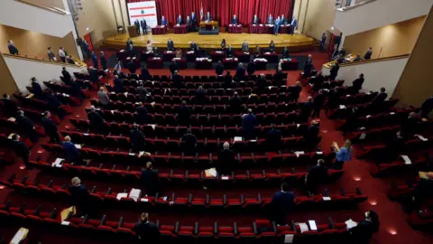 Reuters Lebanese members of parliament attend a legislative session at the Unesco Palace building in Beirut, Lebanon (21 April 2020)