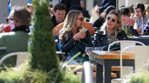 Getty Images Women drink outside