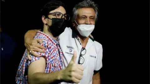 Reuters Venezuelan opposition leader Freddy Guevara gestures as he hugs his father after leaving "El Helicoide" in Caracas, Venezuela August 15, 2021