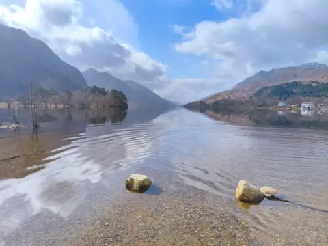 Eve Drabik A view looking over a Scottish loch on a bright day.