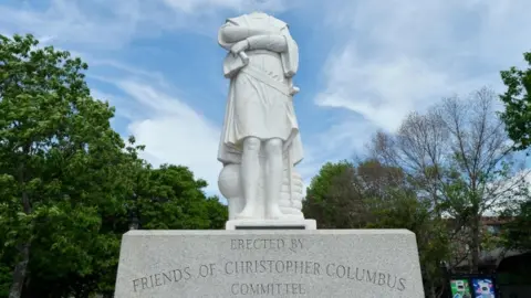 AFP A Columbus statue is decapitated in Boston