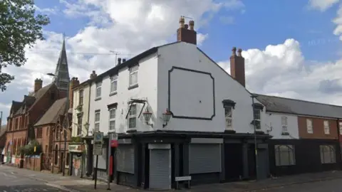 A google street view image of a old derelict pub