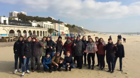 German teachers Anne Ritcher and Stephanie Schmidt with some of their students on Bournemouth beach