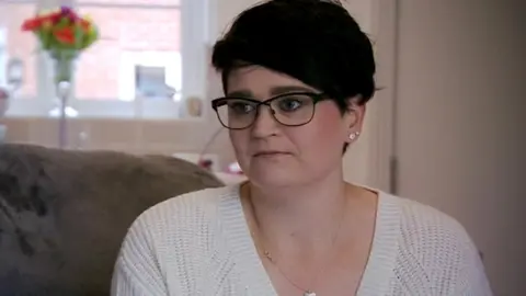 BBC Emily Bristoe sat on a sofa