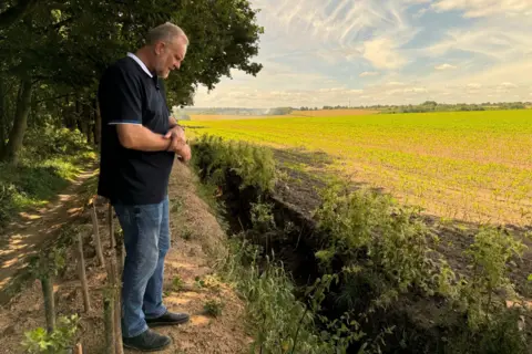 Russell Lowbridge at the site where his grandfather's remains were found