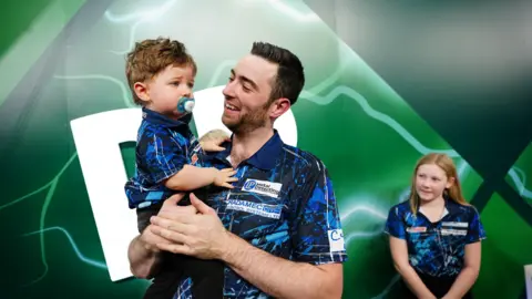 PA Luke Humphries and his son