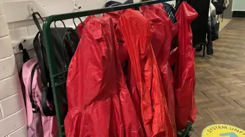 Raincoats bought by the school