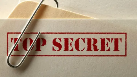 Getty Images A folder marked "top secret"