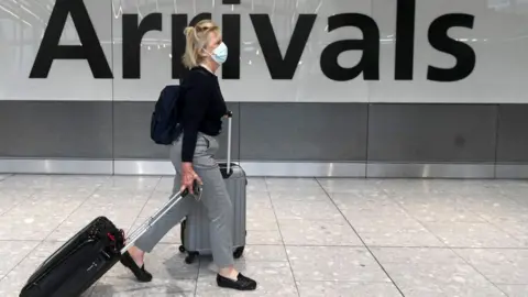 Getty Images Woman arriving at Heathrow