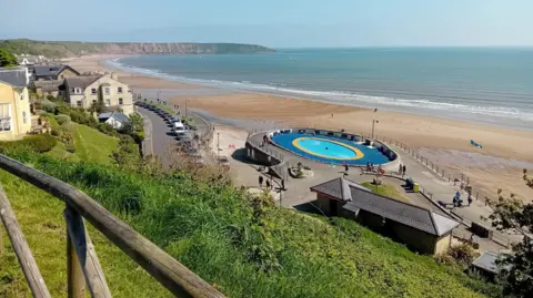 A view of the Filey coastline with beach and cliffs visible