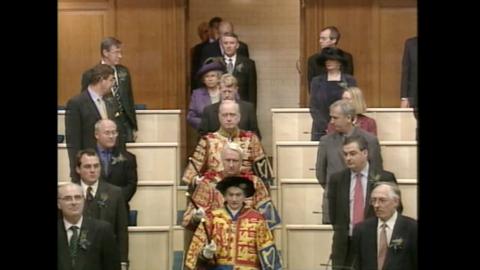 The Queen, as part of a procession, walks into the General Assembly Hall at The Mound, Edinburgh