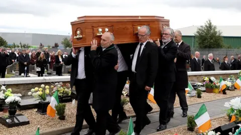 Alamy Bobby Storey's coffin being carried