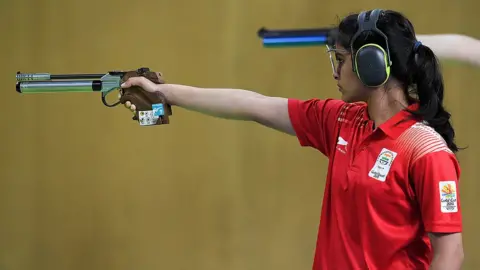 Getty Images Manu Bhaker of India competes in the Women's 10m Air Pistol Final during Shooting on day four of the Gold Coast 2018 Commonwealth Games