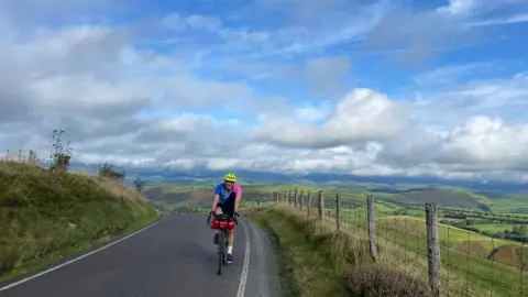 Jamie Spiers Jamie cycling on road
