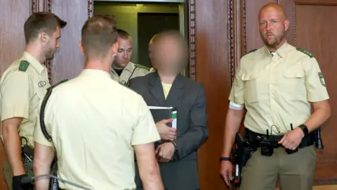 AFP Wolfgang P (centre) in court, Aug 2017