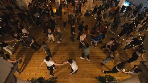 Matt Jarvis  An aerial view of people dancing at a ceilidh at the Elmgrove Centre in Redland in Bristol