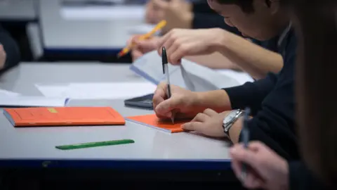 Getty Images Pupils writing