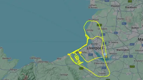flightradar24 Green squiggles on flightradar24 which spell out bored over a map of Wales and Merseyside