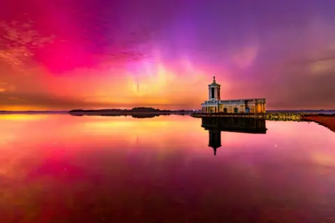 Joel Spencer A view of the Northern Lights at Rutland Water next to Normanton Church