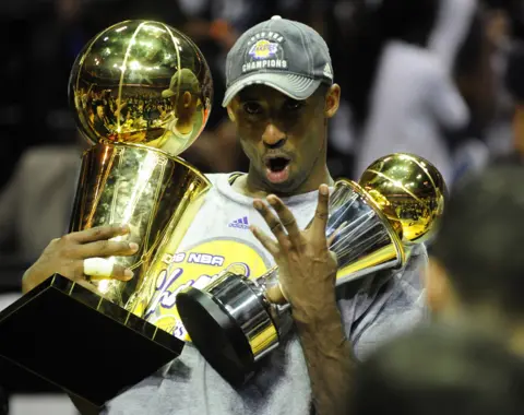 Emmanuel  Dunand / AFP Kobe Bryant of the Los Angeles Lakers celebrates victory following Game 5 of the NBA Finals against the Orlando Magic in Florida in 2009