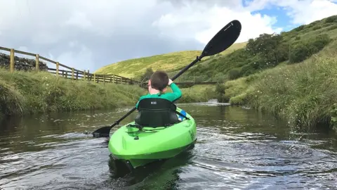 Langholm Initiative Boy in canoe