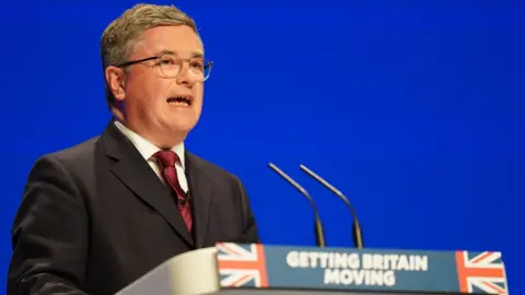 PA Media Robert Buckland speaking during the Conservative Party annual conference at the International Convention Centre in Birmingham.