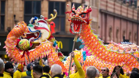 Performers take part in the Dragon Parade as part of Manchester's Chinese New Year Celebrations to welcome in the Year of the Rabbit