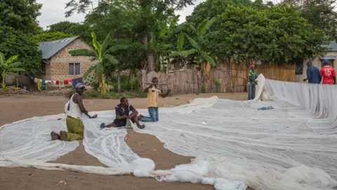 Sala Lewis/World Bank Men in Juma making fishing nets
