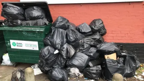 Rubbish piled in Erdington, Birmingham in February