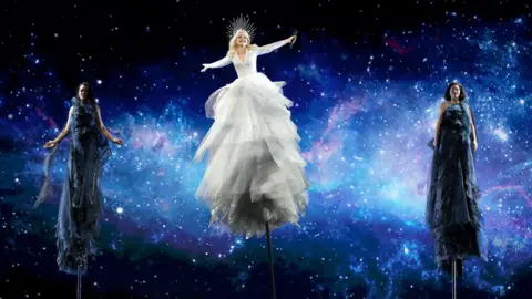 EPA Australia's Kate Miller-Heidke (centre) with backing performers